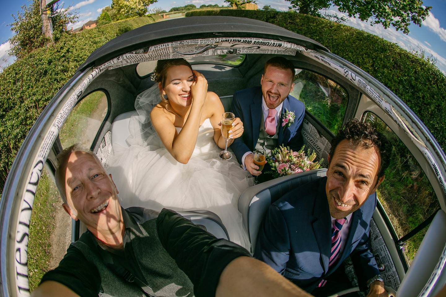 shropshire wedding photographer phil barrett with bride and groom aboard Herbie