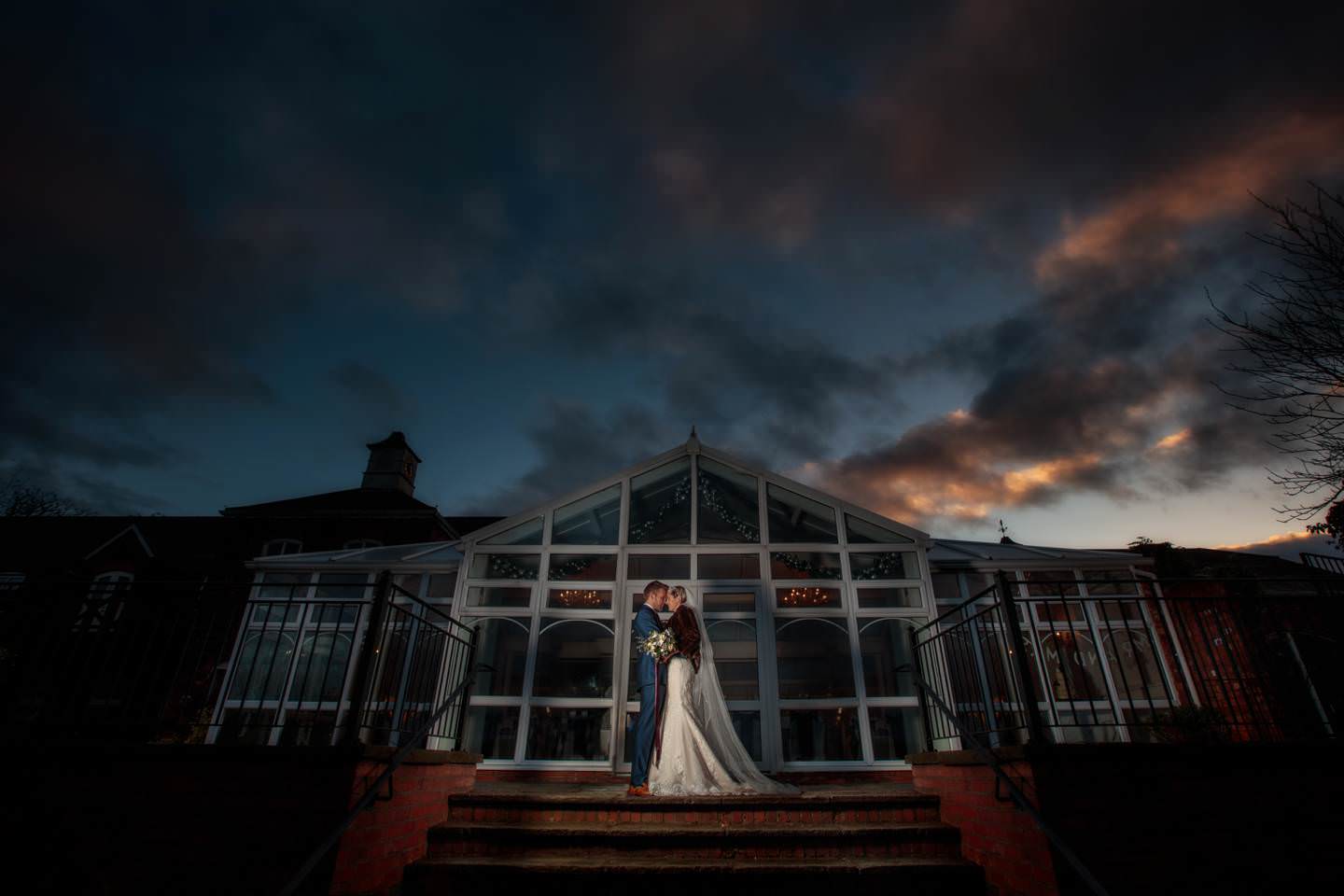 Aimee and Mike enjoy their creative Lion Quays Wedding Photography outside the reception venue with PbArtWorks 