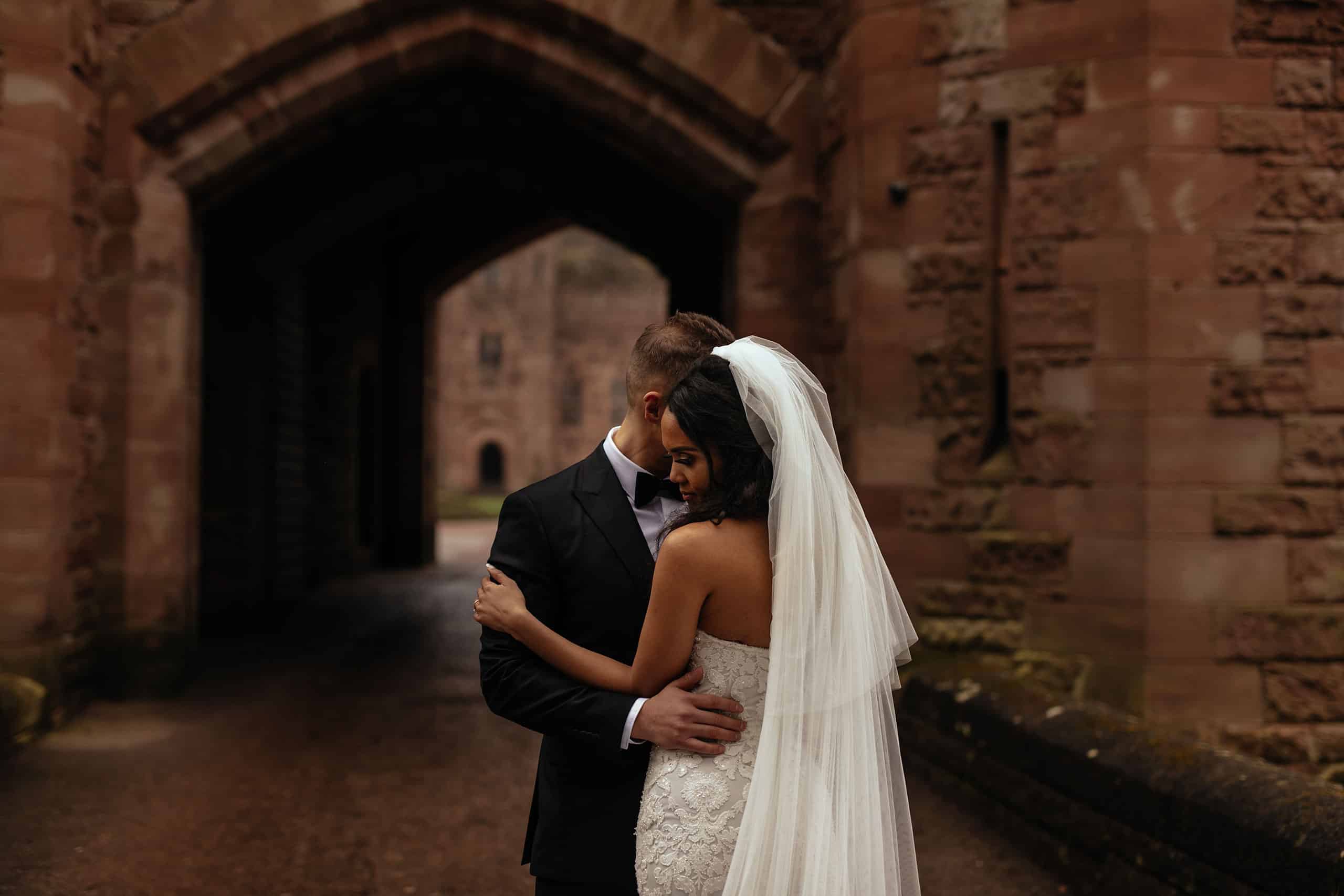 A bride and groom at Peckforton Castle