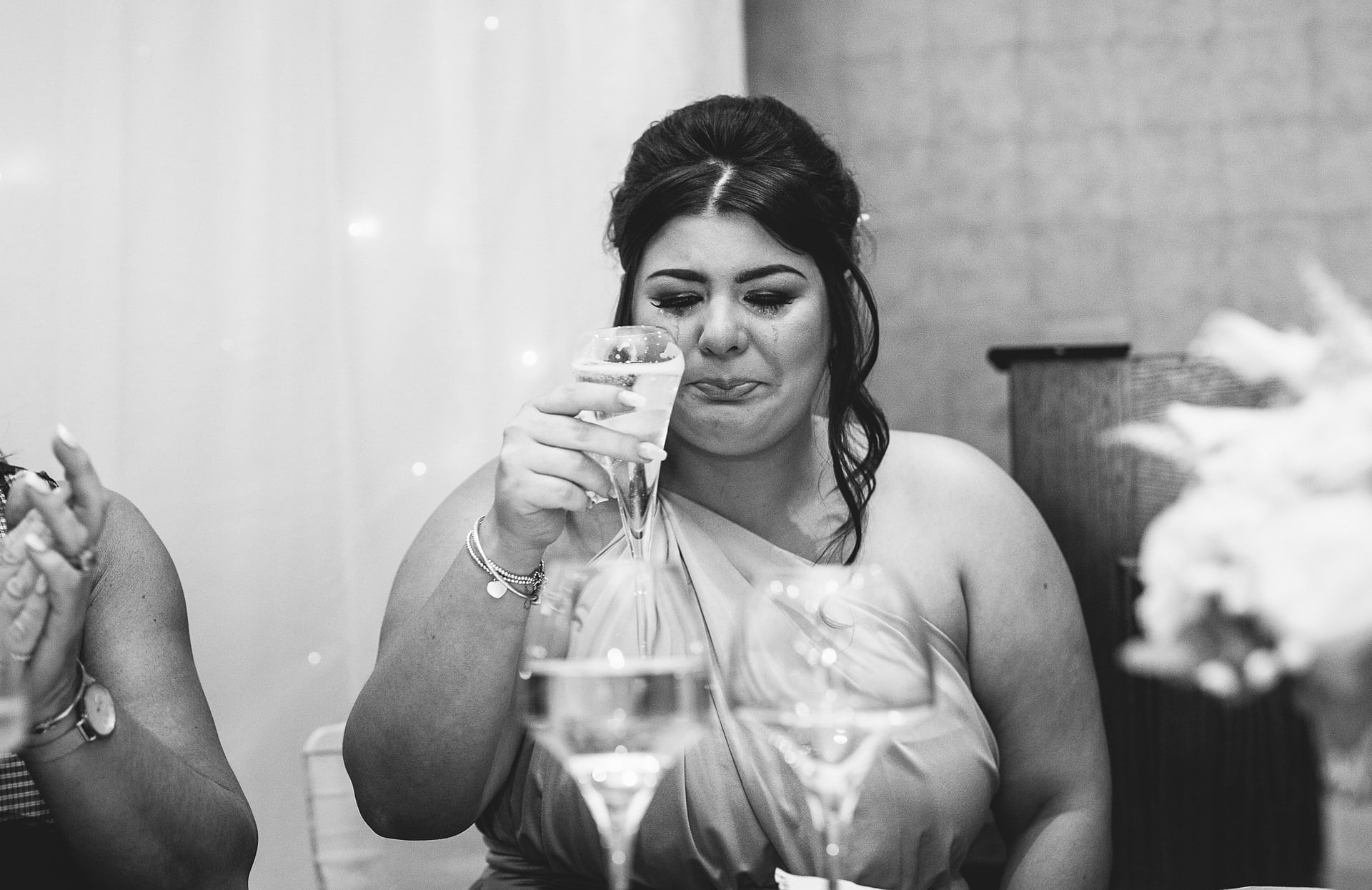 An emotional bridesmaid captured by Shropshire Documentary Wedding Photographer