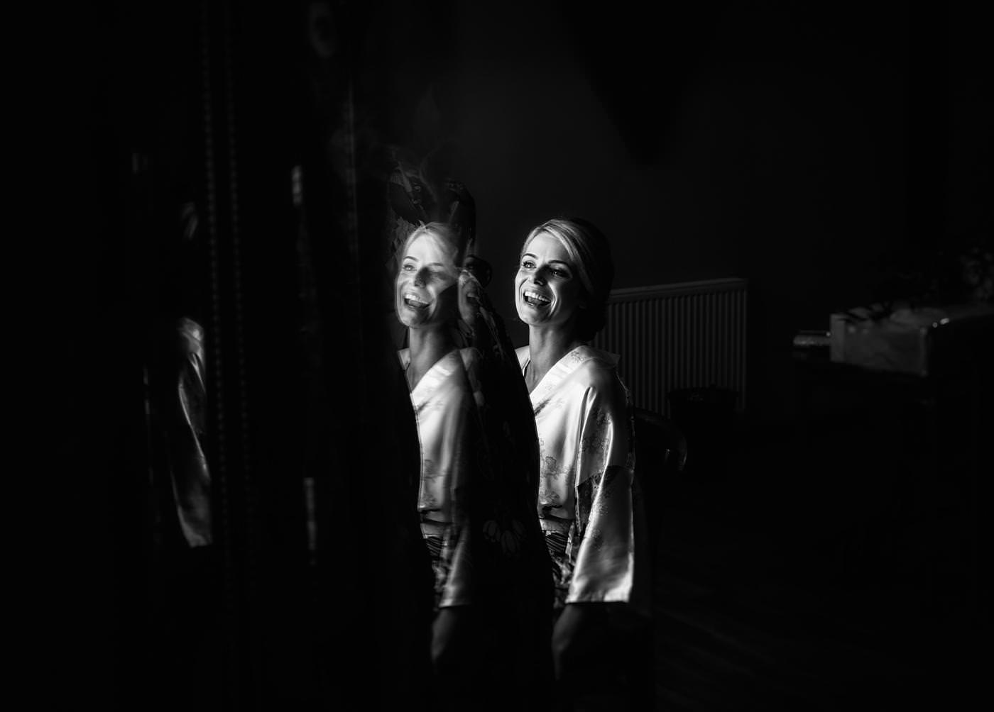 black and white image of the bride as she get's ready at the Mill Barns venue in Shropshire