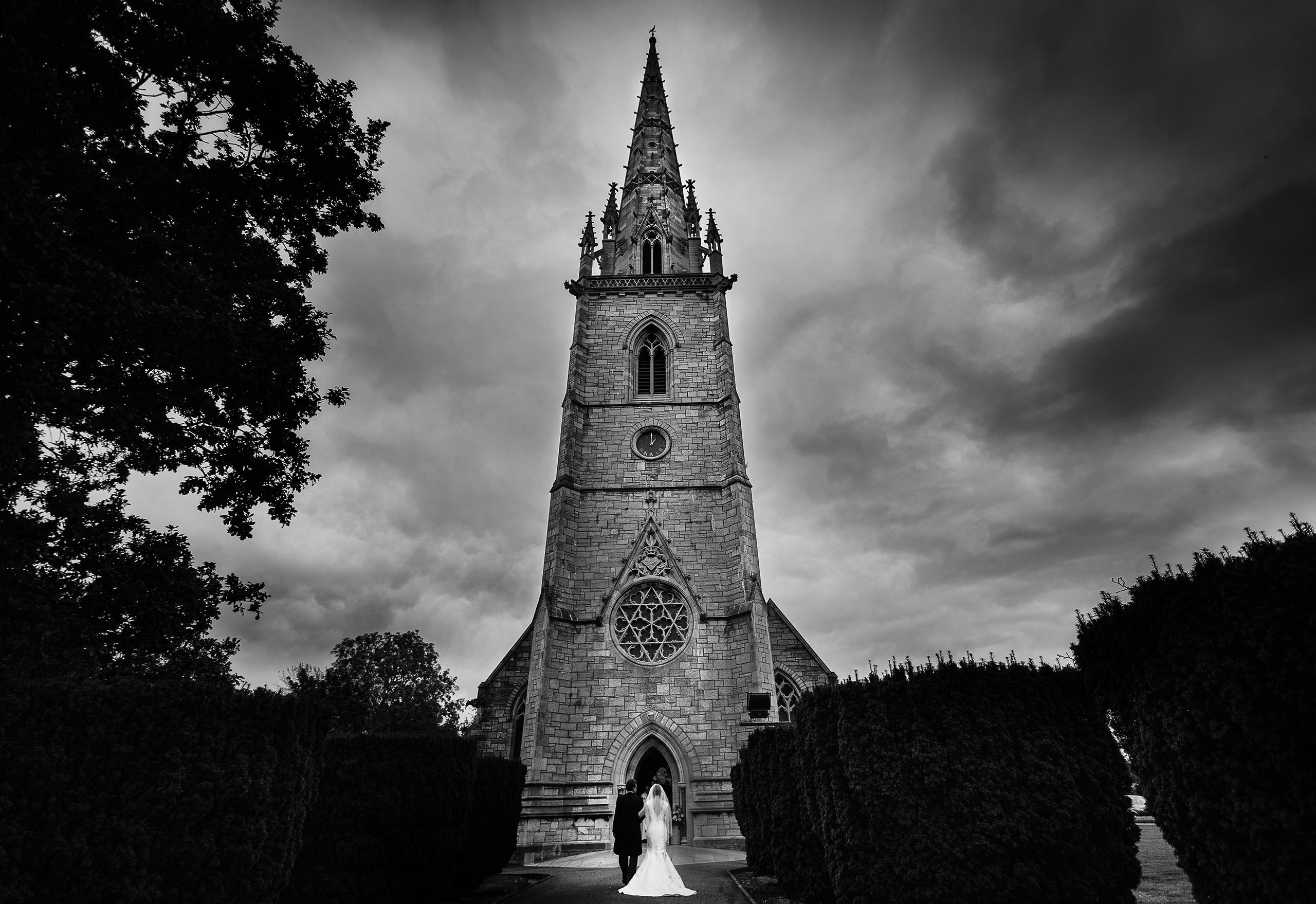 the bride and her Father arrive at the amazing Marble Church in North Wales captured by Shropshire documentary wedding photographer Phil Barrett
