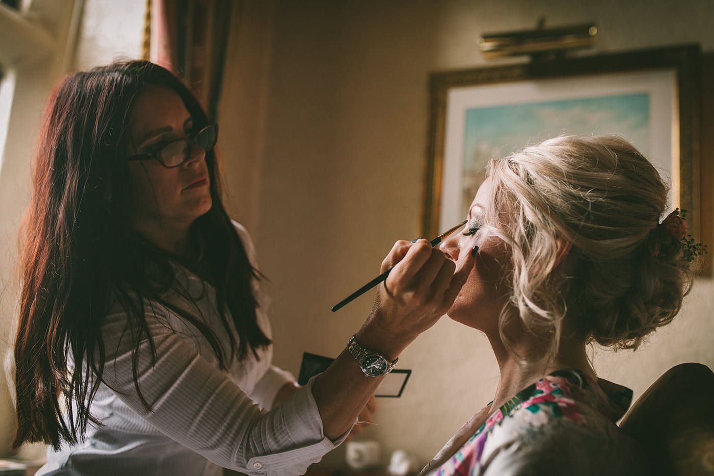 Shropshire Wedding Makeup Artist Applies make up to bride