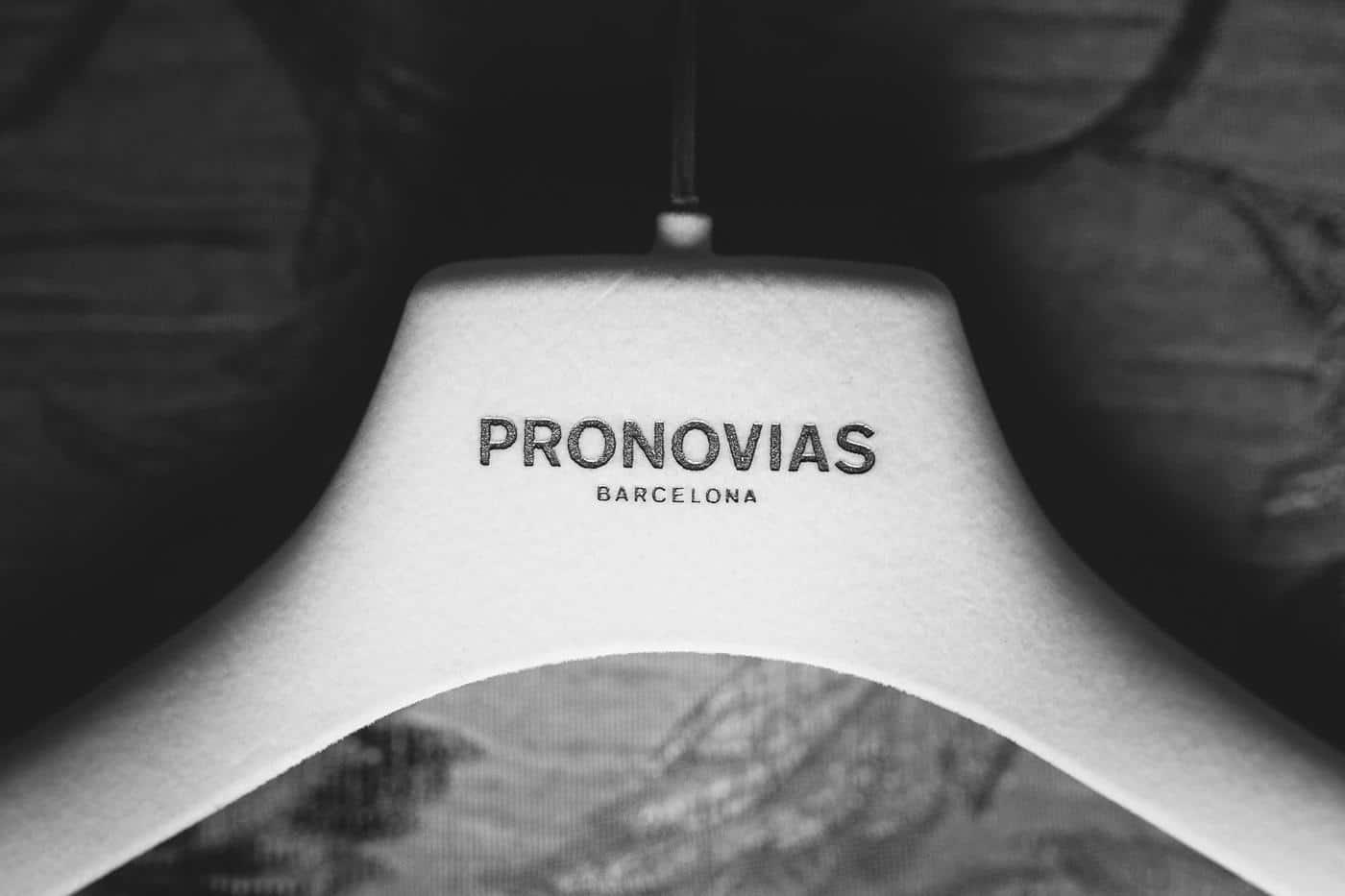 a close up image of a provonias wedding dress hanger