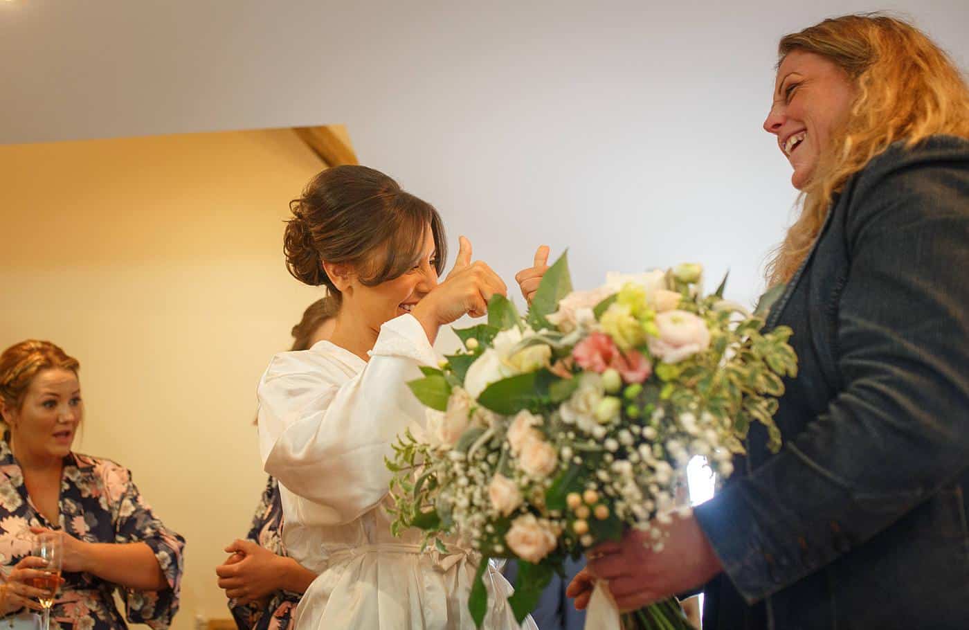 a bride inspects her bridal flowers