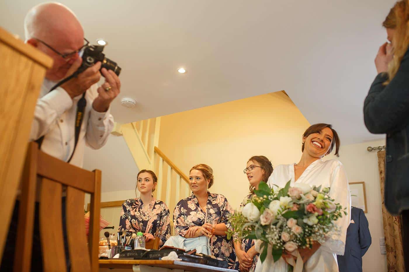bride and bridesmaids having a photograph taken