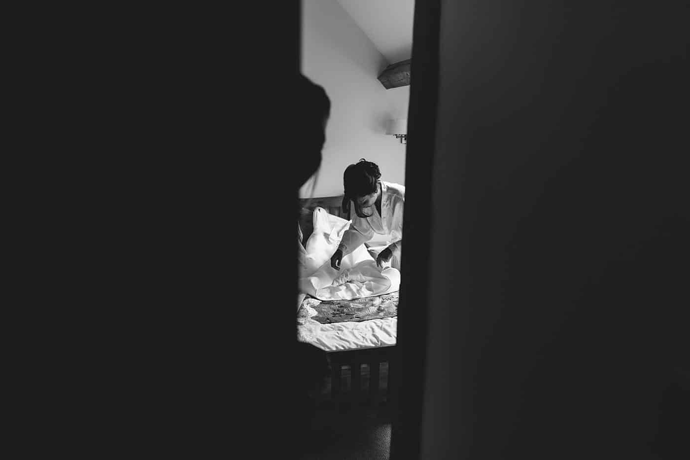 a candid shot of bride through a open door