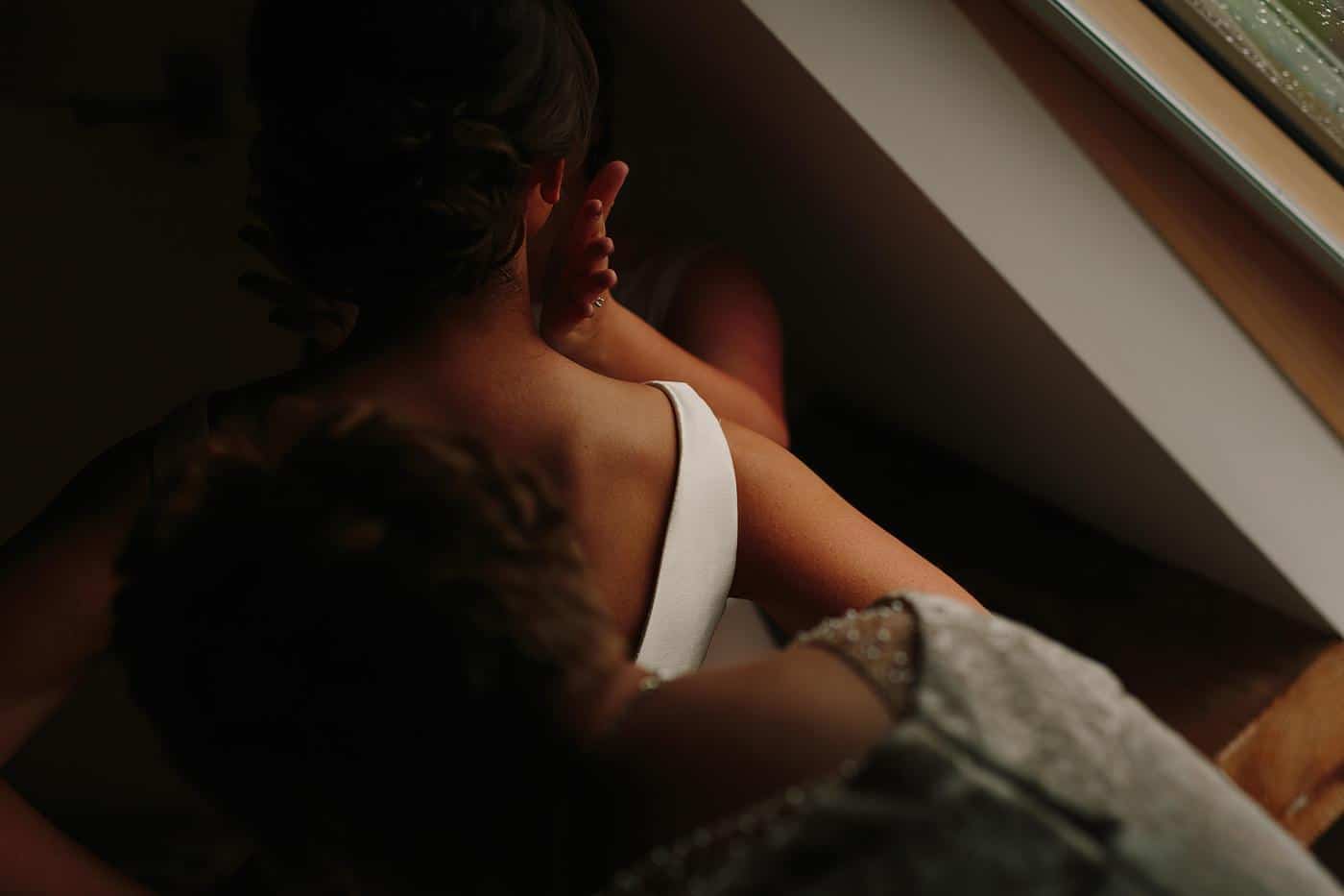 a detail photograph of a bride in her dress