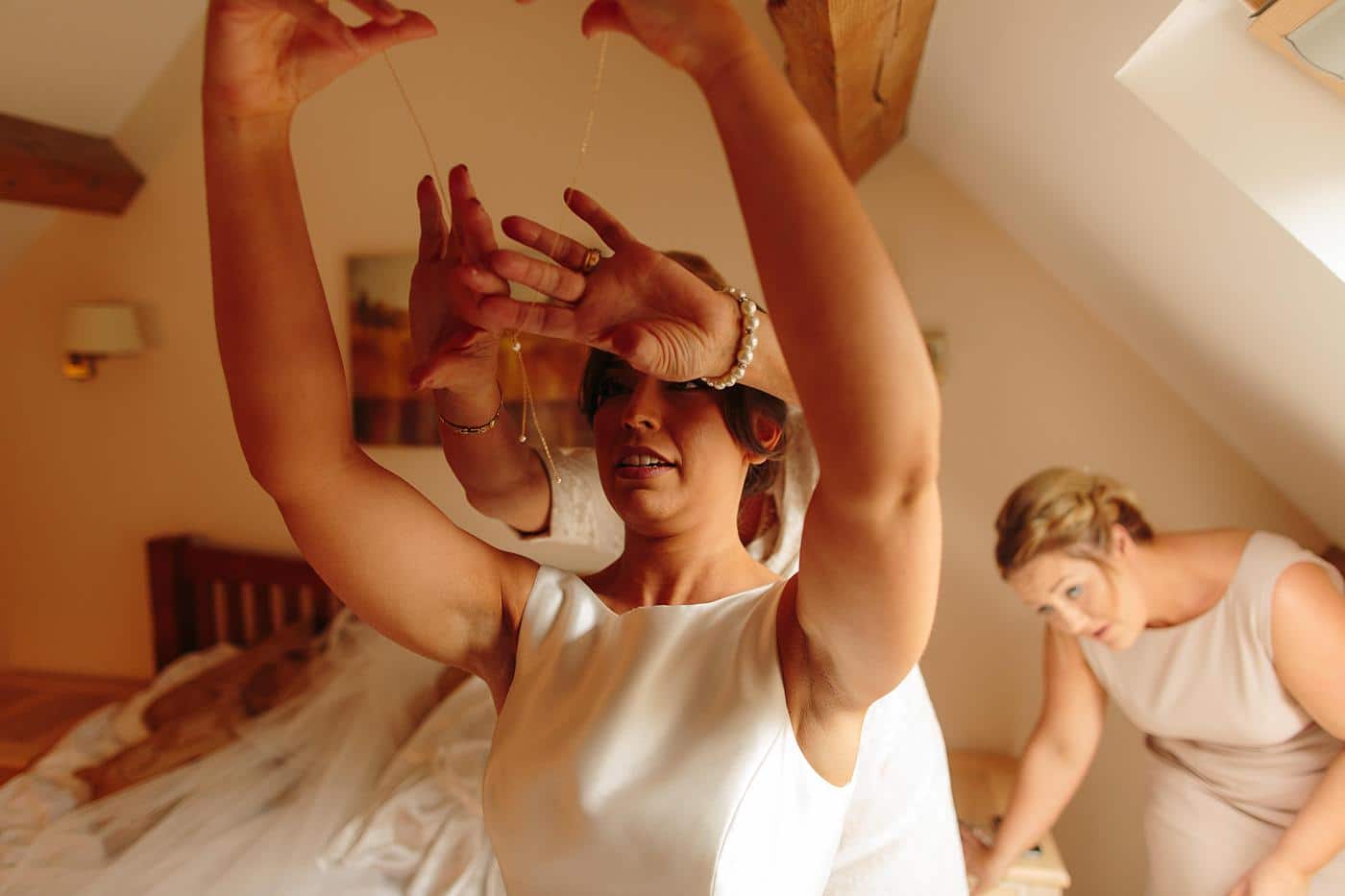 bride putting on the final touches