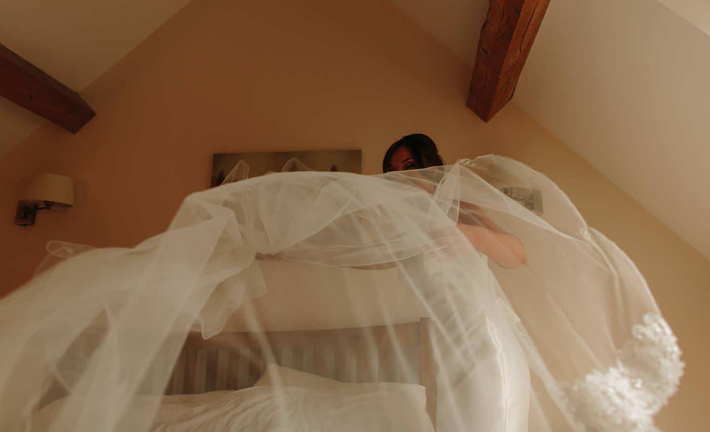 a veil is spread out by a bride