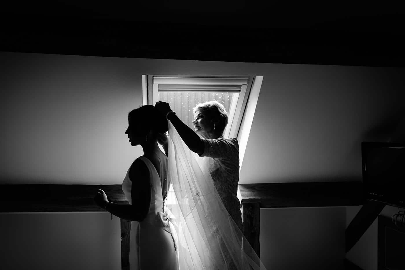 the bride's mother places the veil