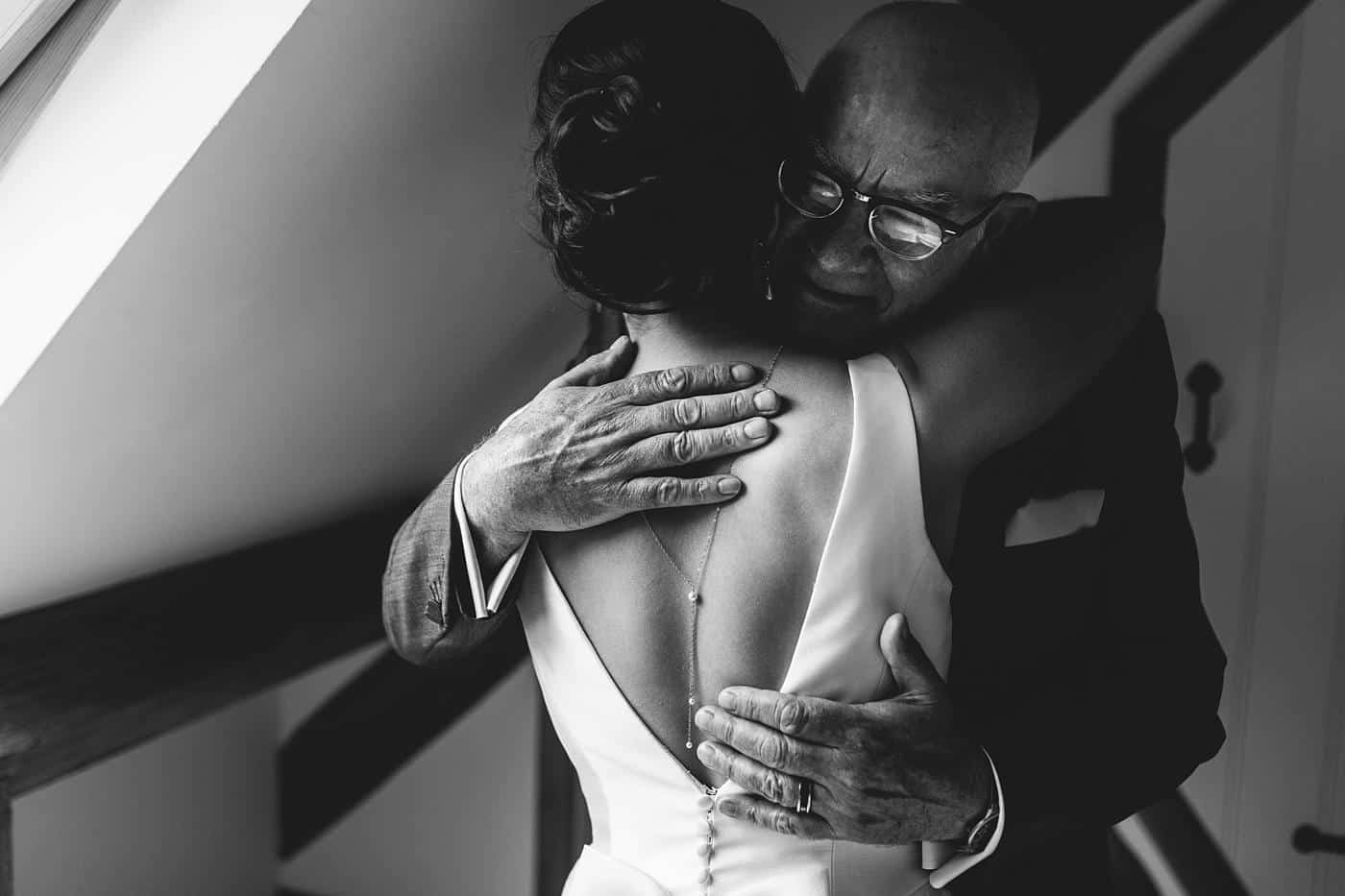 bride and her Father hug before leaving for Winstanstow Church