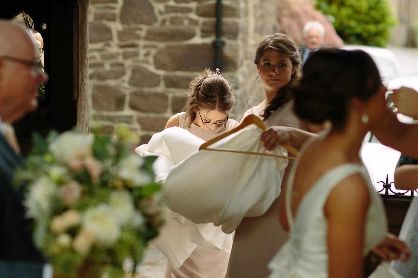 A bride and her bridesmaids are getting ready in Wistanstow Village Hall for their wedding.