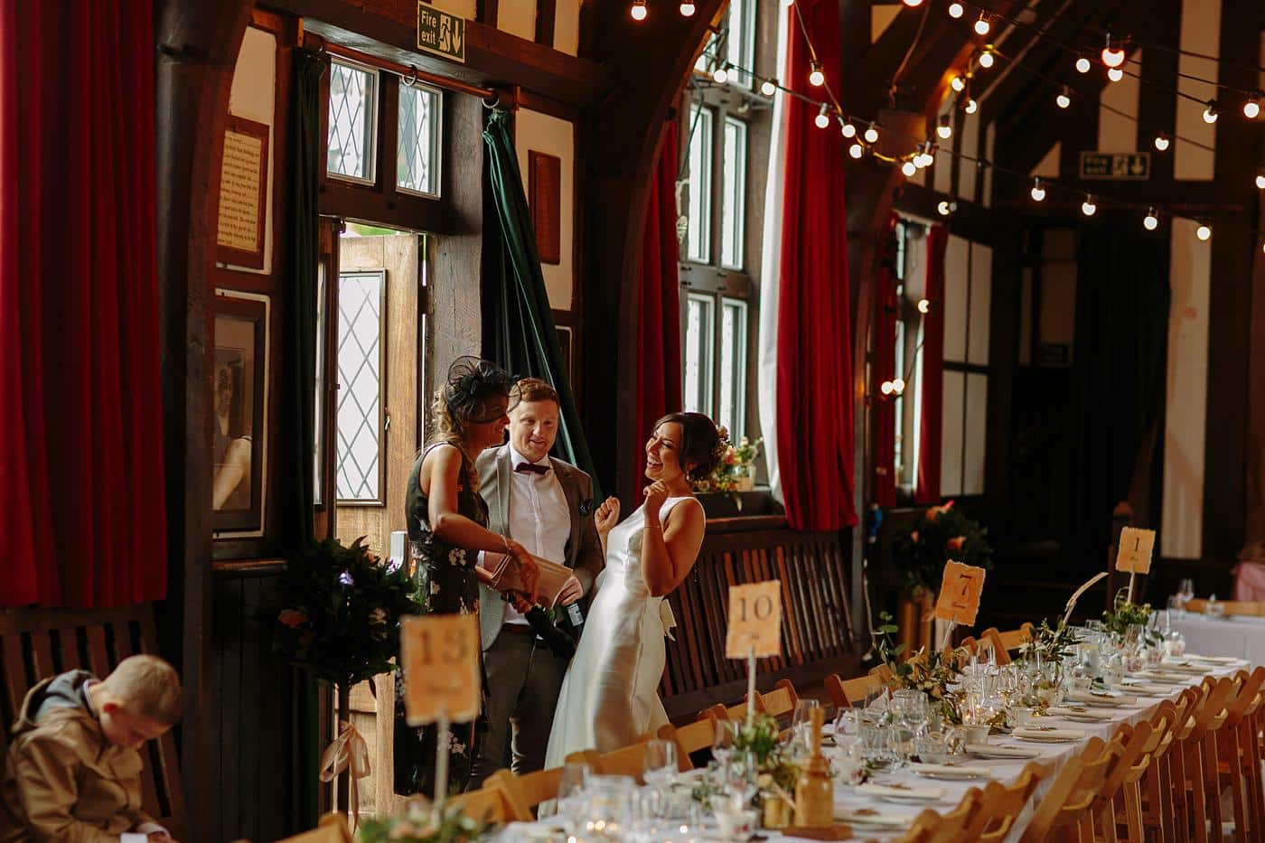A joyful bride and groom celebrating their union at the picturesque Wistanstow Village Hall Wedding reception.