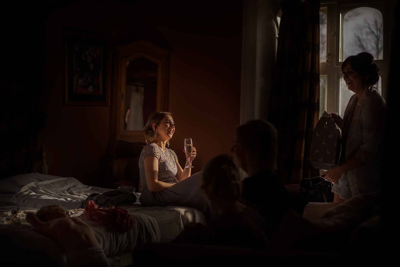 a beautiful light captures a young bridesmaid