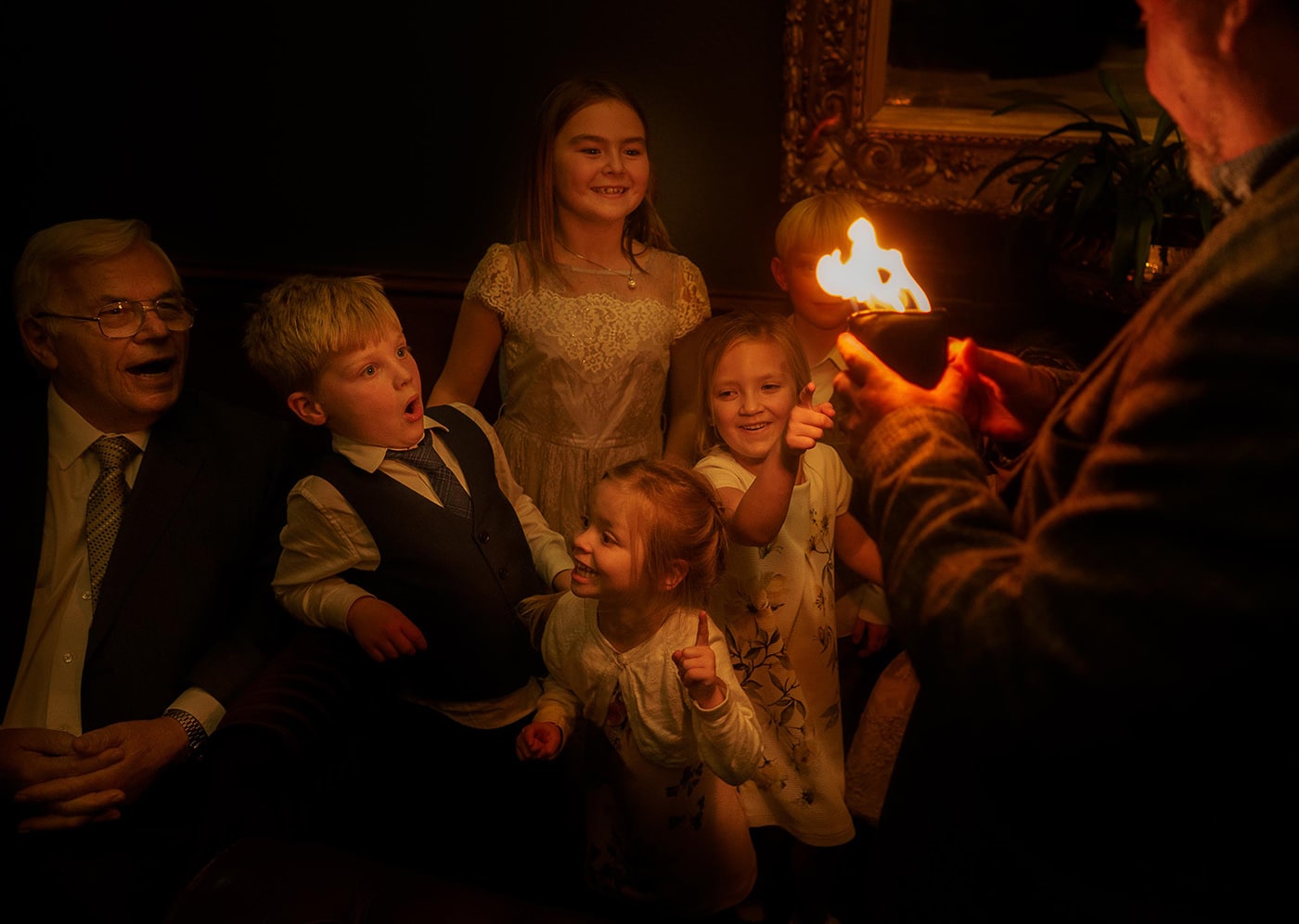 beautiful scene as children are entertained at a winter wedding in Ruthin Castle