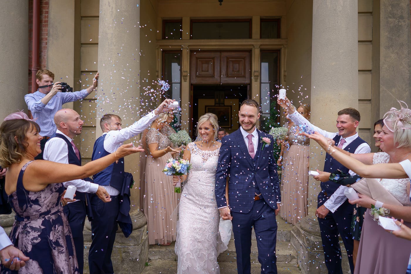 The confetti is thrown at a Netley Hall wedding day