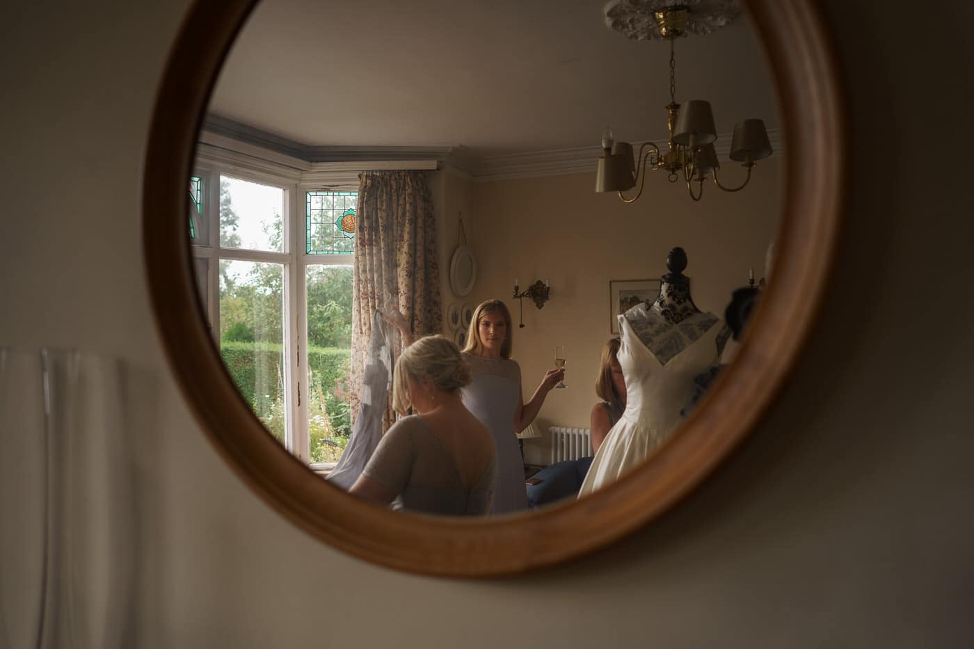 wedding photographer in shropshire captures candid moments at wedding in mirror