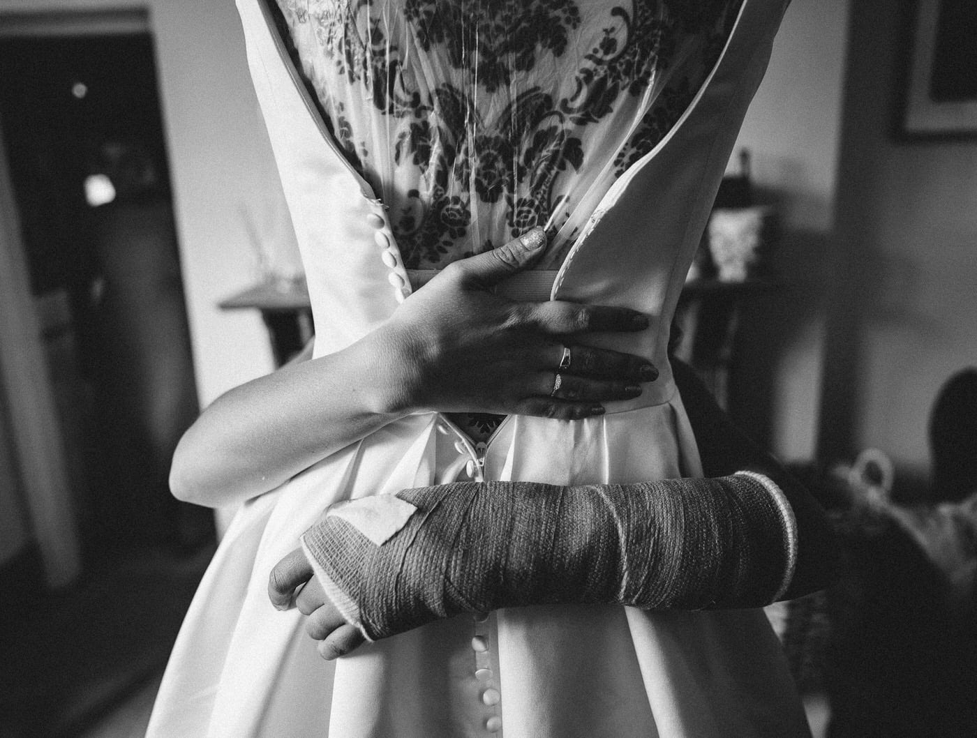 bride hugs her dress at shropshire wedding