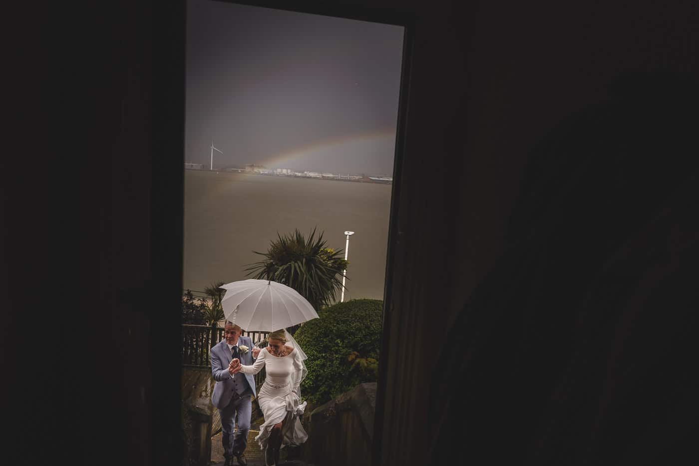 bride and groom returning home in a storm