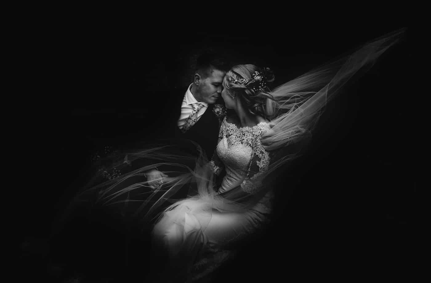 Bride and groom in monochrome outside their shropshire church