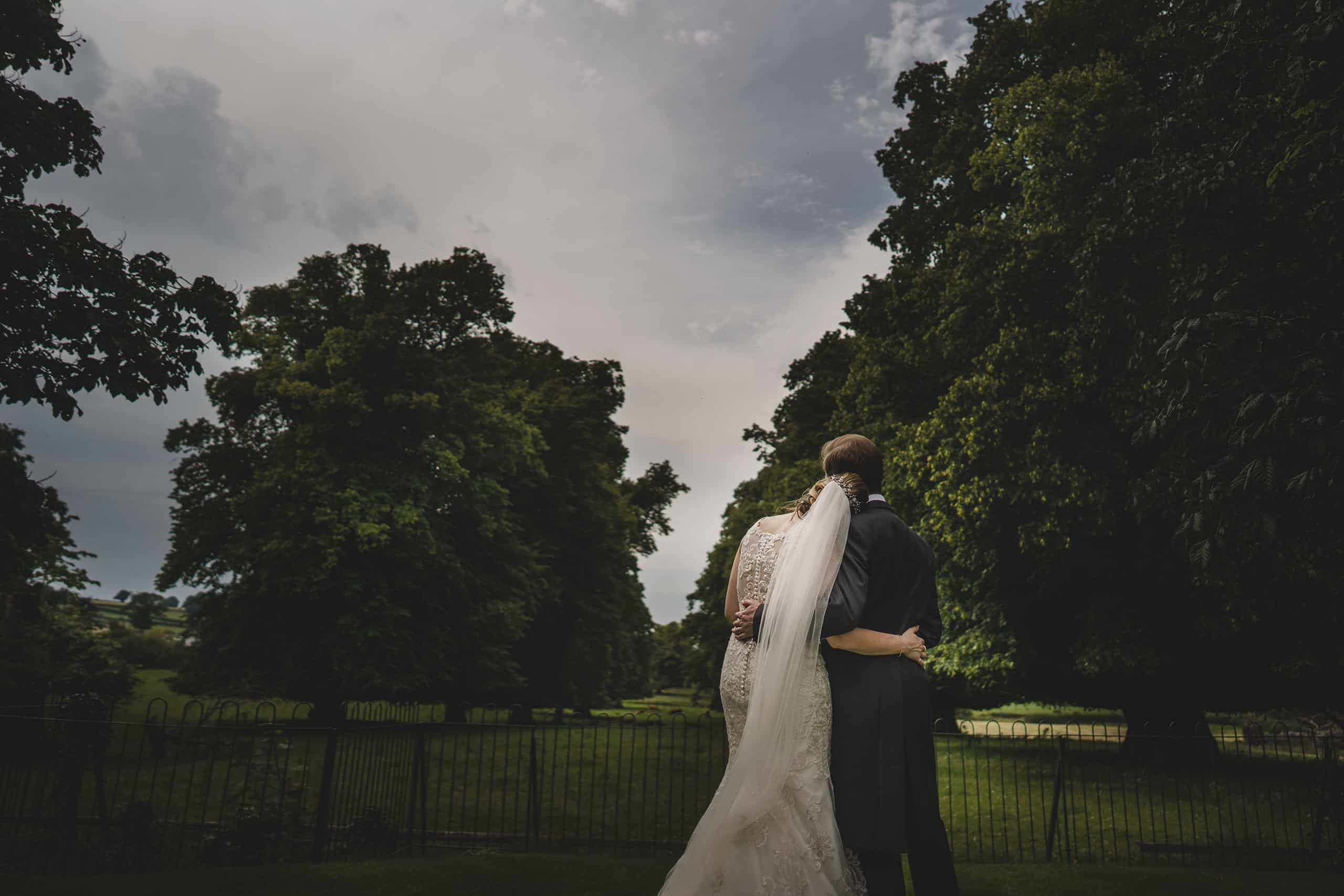 the bride and her groom share a quiet moment during their rowton castle wedding