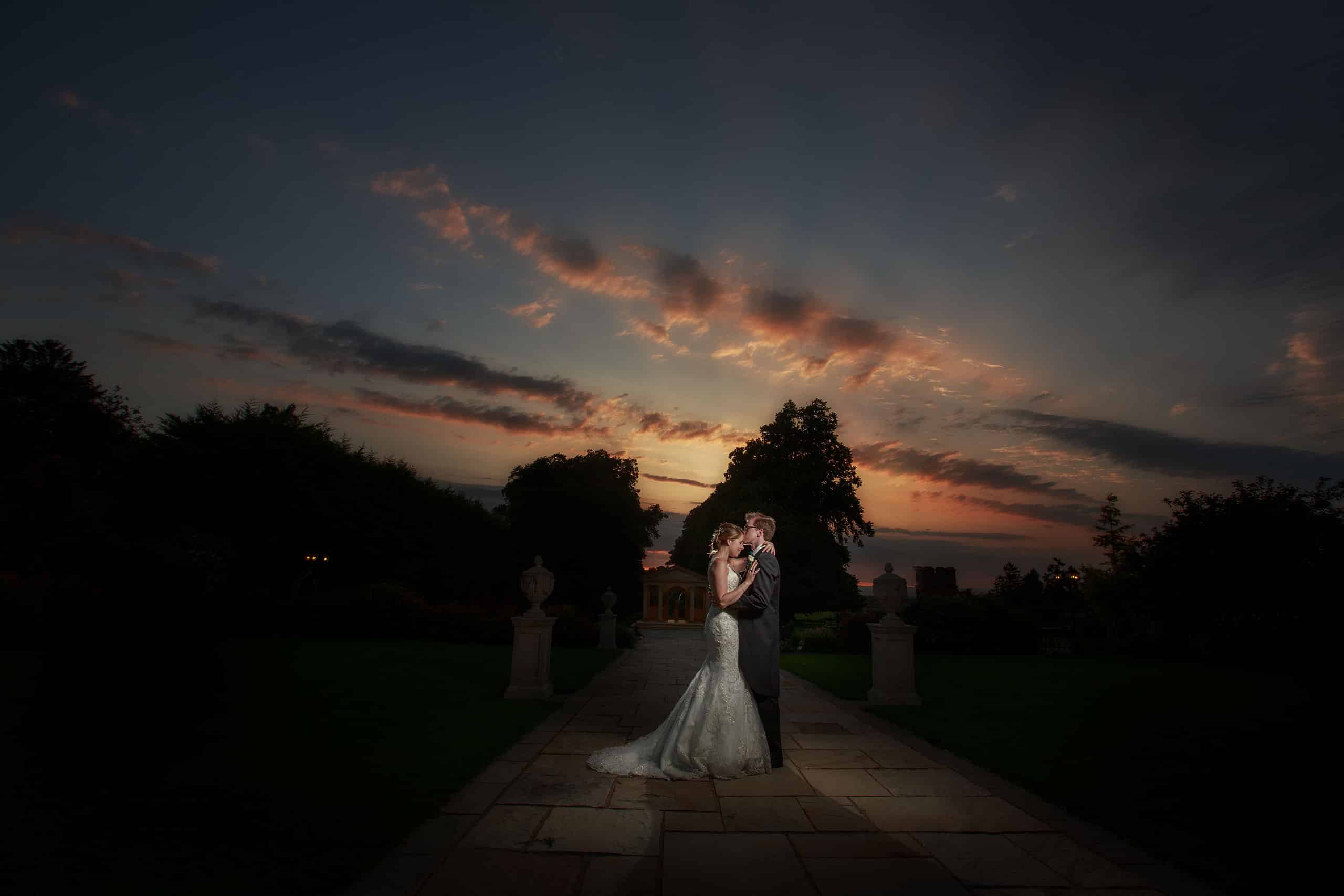 a stunning sunset provides the perfect end to this gorgeous rowton castle wedding