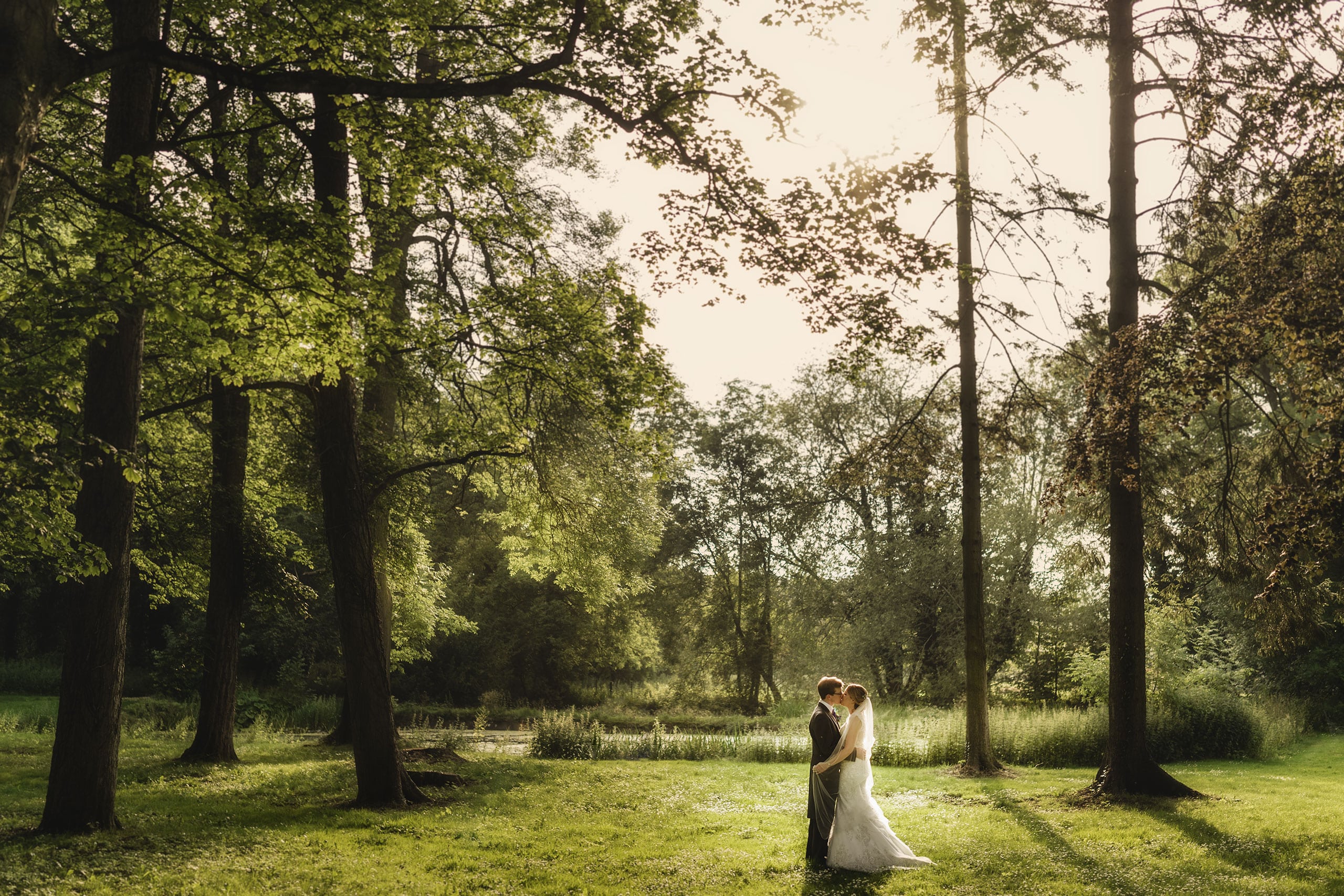 the bride and groom share an intimate moment in the grounds of Rowton Castle