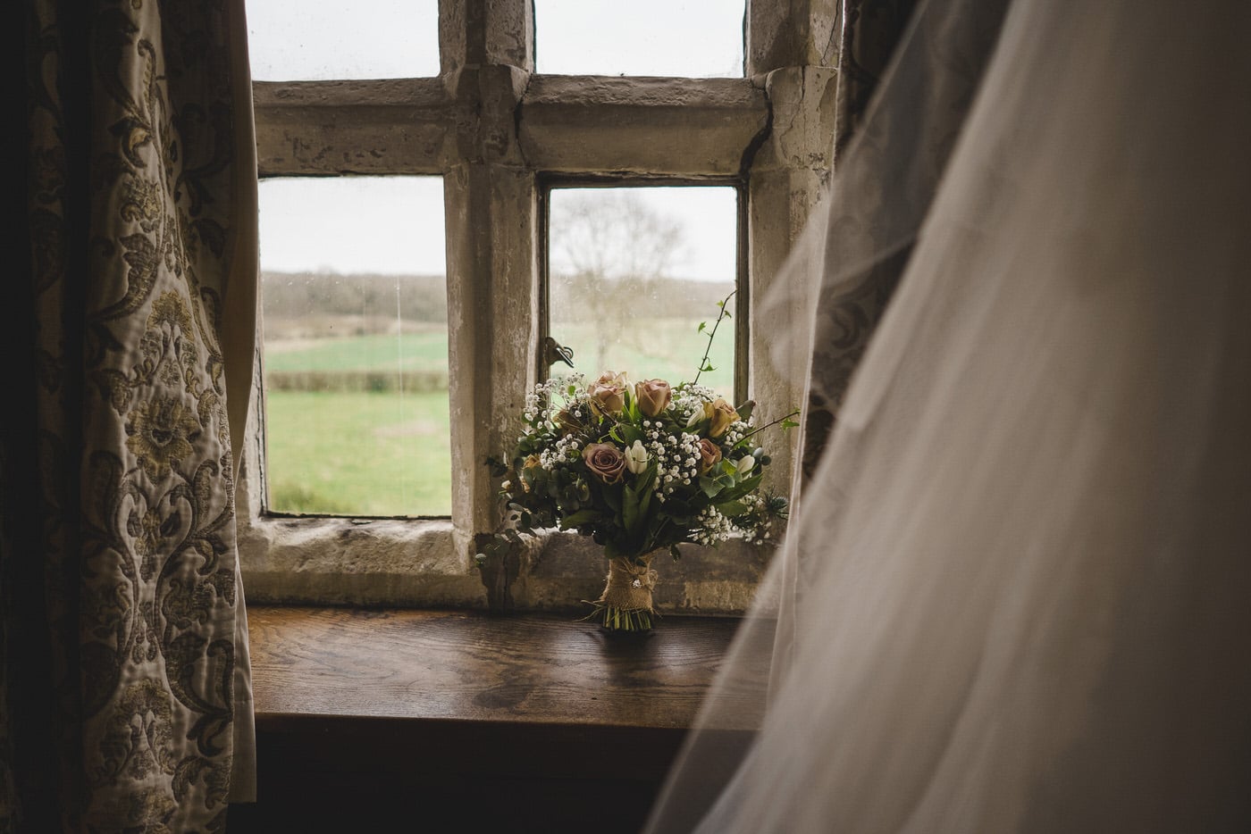 Bridal flowers on a window sill at soulton hall in shropshire