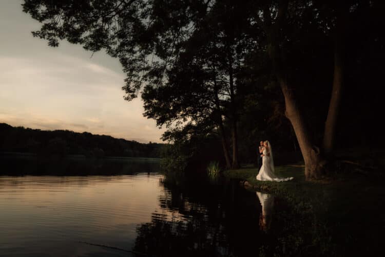 a beautiful scene as the couple take time out by the side of the mere