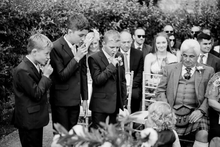 A black and white photo capturing a wedding ceremony by a Shropshire Wedding Photographer.