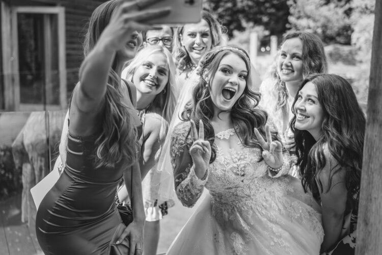 A bridal party capturing a selfie with a Shropshire wedding photographer.