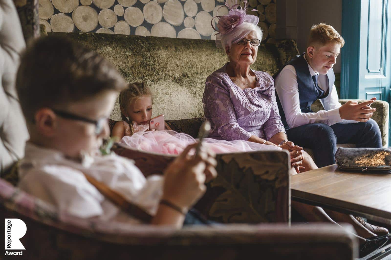 wedding day guests on their mobile phones