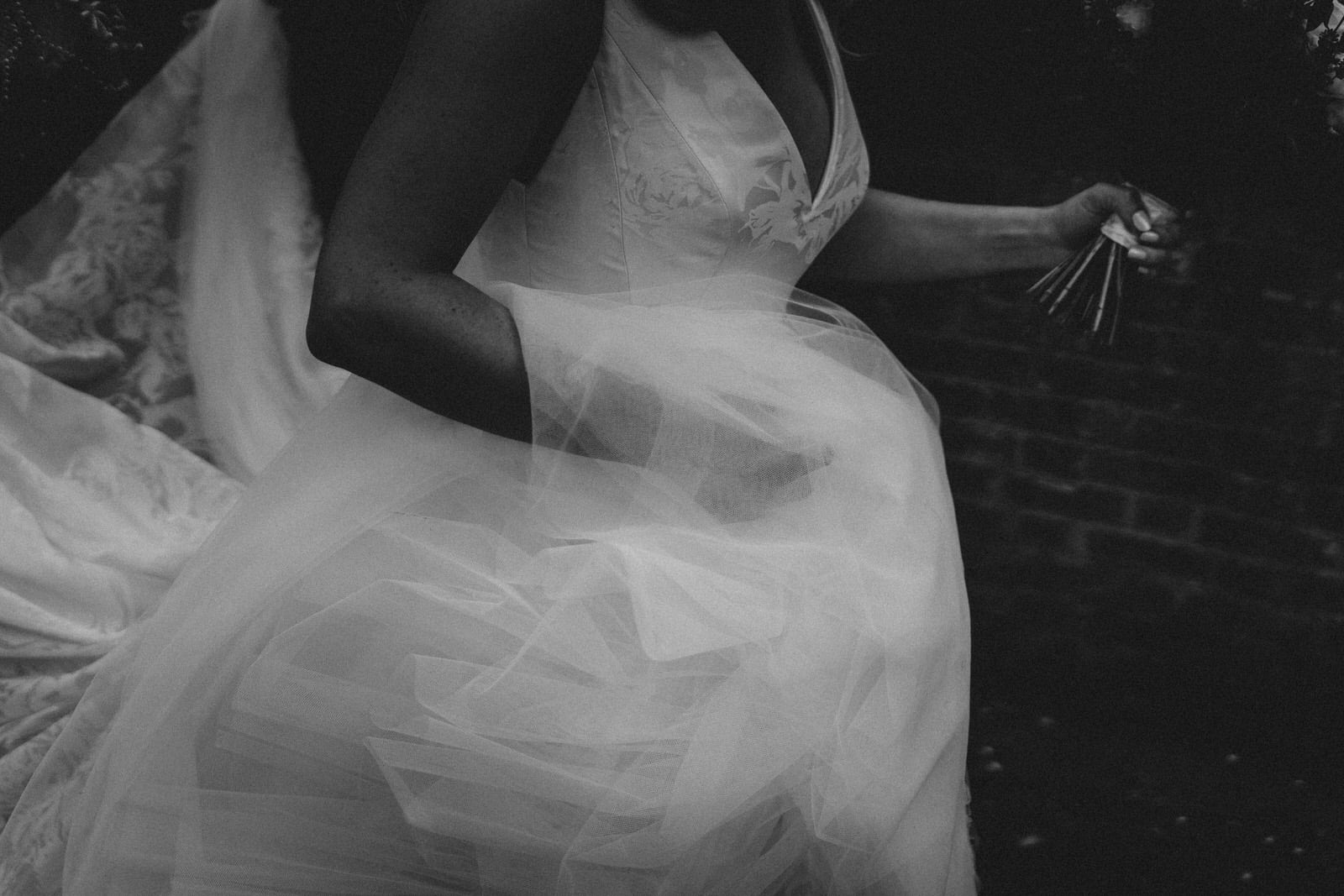 black and white photo of a bride in a wedding dress.