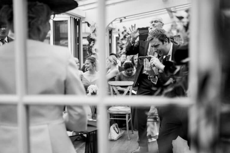 a black and white photo of a wedding ceremony at foxtail barns.