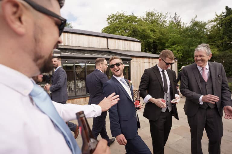 a group of men in suits discussing business ideas.
