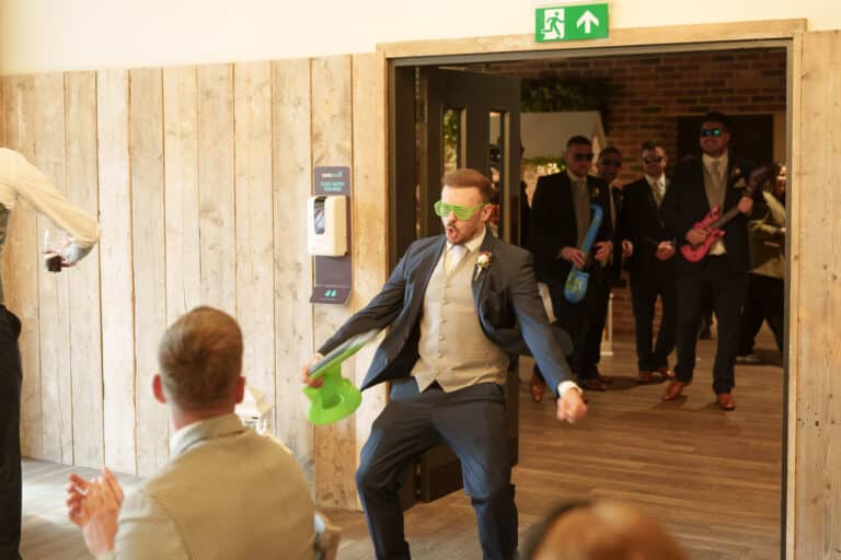 a man in a suit is throwing a green frisbee.
