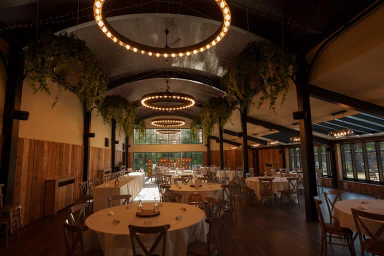 a spacious room with tables and chairs.