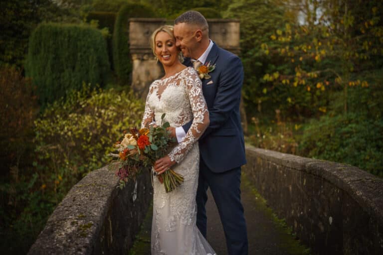a bride and groom embracing on a foxtail barns.