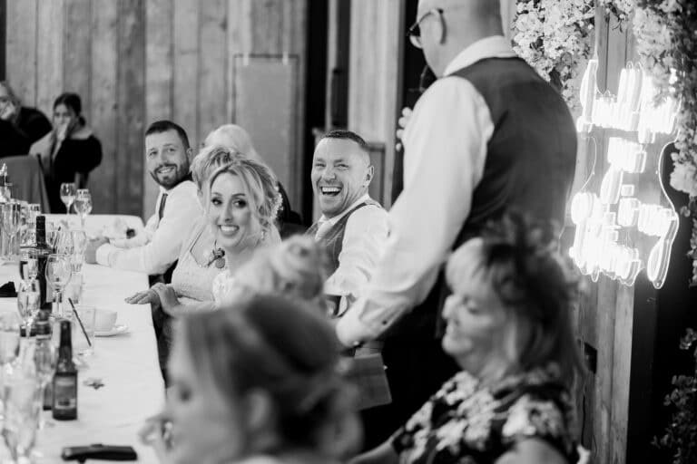 a black and white photo of a wedding reception at foxtail barns.